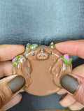 Hands holding brown clay dragon worry stone hand made from polymer clay for comfort and control stress and anxiety
